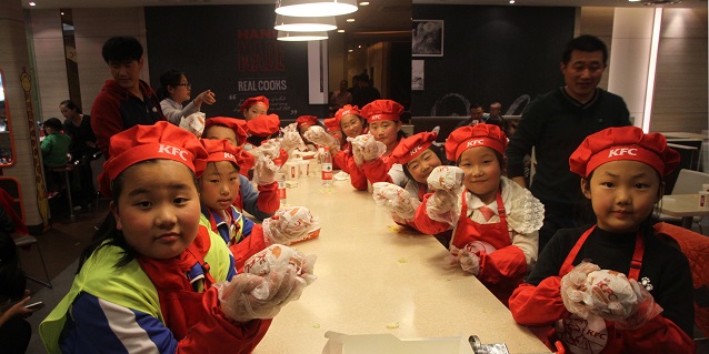 hand-in-hand-you-and-me-as-asia-symbol-staff-warm-the-weekend-of-left-behind-children-in-rizhao-1